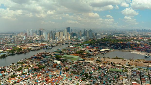 Cityscape of Makati with sea port,the business center of Manila, view from sea. Asian metropolis. Travel vacation concept.