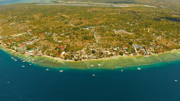 Coastline with coral reef and blue water, diving site, Moalboal, Philippines. Aerial view, Summer and travel vacation concept.