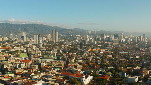 Cebu City, a major city on the island of Cebu, with skyscrapers and residential buildings in the early morning. Philippines.