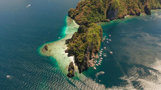 Tropical beach and clear blue water. El nido, Philippines, Palawan. Seascape with tropical rocky islands, ocean blue water. Summer and travel vacation concept