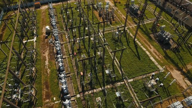 Aerial view Power plant, transformation station, cables and wires. High voltage electric power substation. Electrical power transformer in high voltage substation,