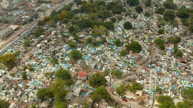 Manila North Cemetery in Manila, Philippines. Many of the mausoleums are inhabited by impoverished families. Travel concept.
