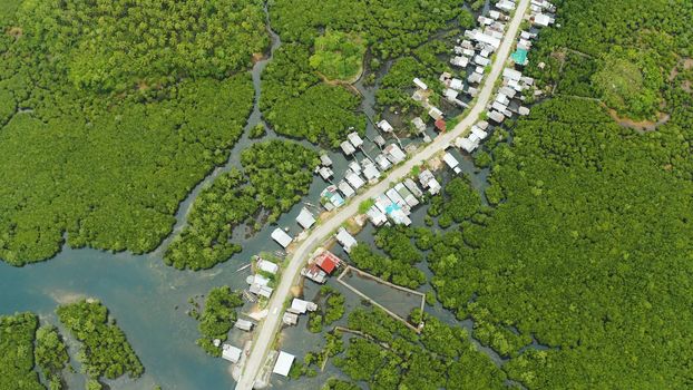The village and the highway among the mangroves from above. Siargao island, Philippines.