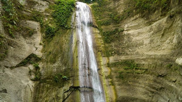 Beautiful waterfall in green forest. Tropical Dao Falls in mountain jungle, Philippines, Cebu. Waterfall in the tropical forest.