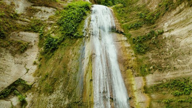 Beautiful waterfall in green forest. Tropical Dao Falls in mountain jungle, Philippines, Cebu. Waterfall in the tropical forest.