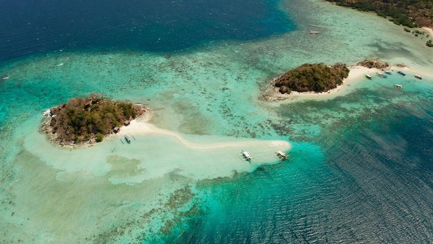 aerial view tropical beach with white sand and clear blue sea. tropical landscape with islands and beaches. Philippines, Palawan.