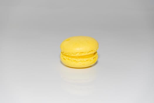 yellow macaroons on a gray background. isolate. High quality photo