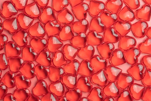 red hearts on a pink background close-up. photo