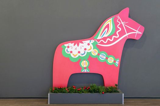 figure of a red horse on a gray background. High quality photo