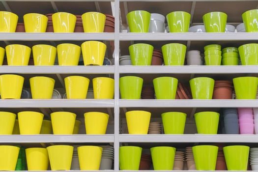 colorful flower pots on the shelves of the store . for the entire frame. High quality photo