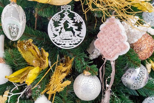 fir branches decorated with christmas toys close up. High quality photo