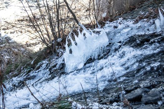 wild river in winter with spray