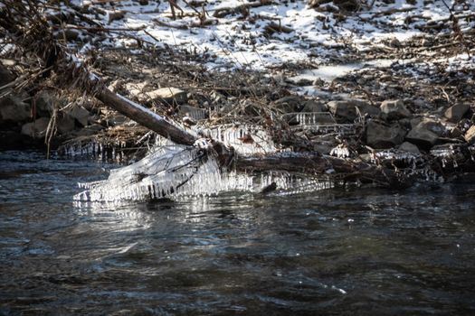 wild river in winter with spray