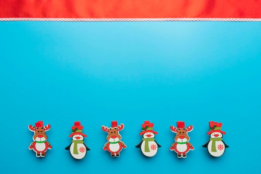 new year's card. toys and branches of thuja on a blue background. High quality photo