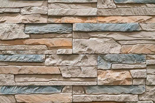 masonry wall paving stones as a background close up