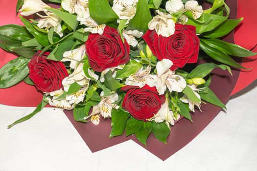 bouquet of red roses and white alstroemeria flowers close up. High quality photo