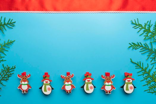 new year's card. toys and branches of thuja on a blue background. High quality photo