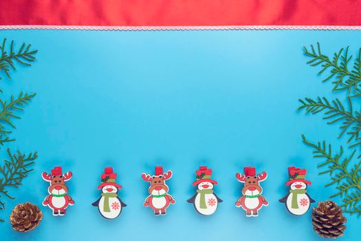 new year's card. toys and branches of thuja on a blue background. High quality photo