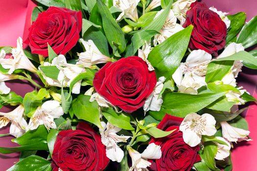 bouquet of red roses and white alstroemeria flowers close up. High quality photo