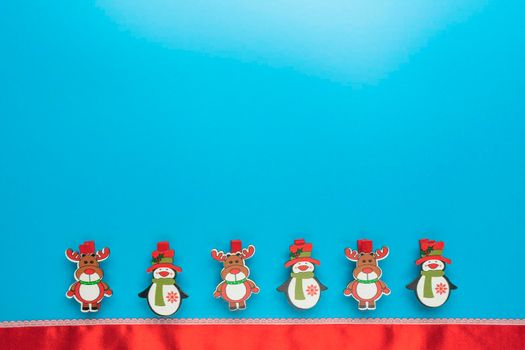 new year's card. toys and branches of thuja on a blue background. High quality photo