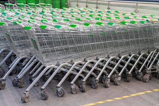 grocery carts in the shopping center parking lot. High quality photo