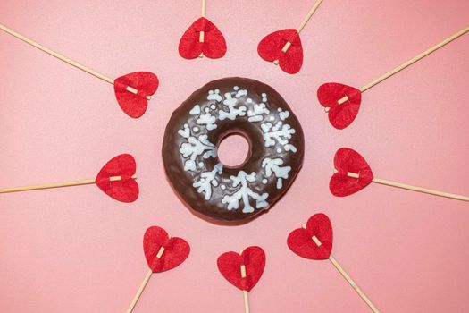 donut donuts on a pink background with hearts close-up. isolate. High quality photo