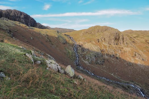Water cascading from the top of the fells down the valley of Stickle Ghyll, Langdale Pikes, Lake District, UK