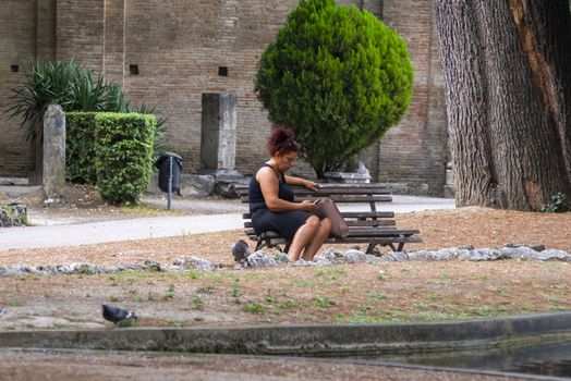 terni,italy august 16 2020:woman in the park alone cause covid 19