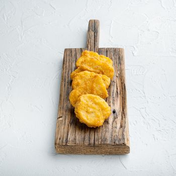 Nuggets breaded on white background.