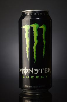 OTTAWA, ON, CANADA, FEBRUARY 6, 2021: Can of Monster Energy Drink on a dark gradient background.