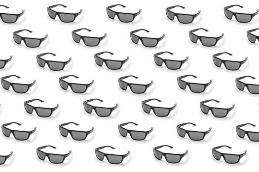 colorful pattern of sunglasses on a white background top view. High quality photo