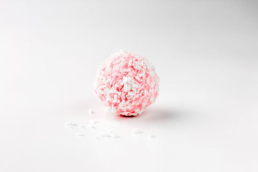 pink chocolate candy on a white background. candy ball macro. isolate. High quality photo