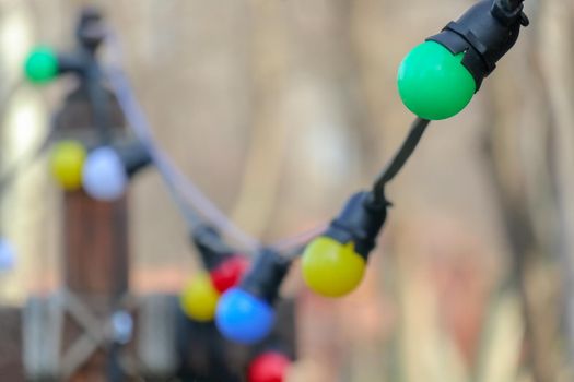 garland of colored light bulbs on a beautiful background. High quality photo