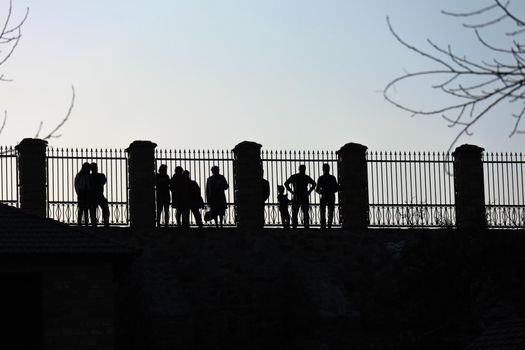 people standing behind the fence as background. High quality photo