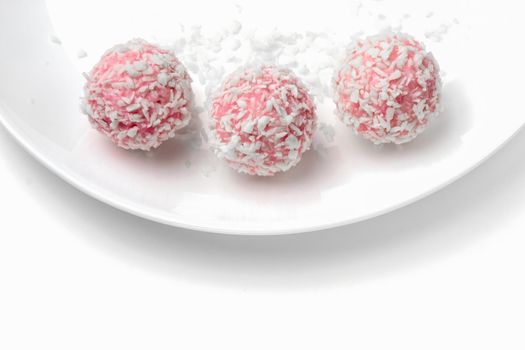 pink chocolate candy on a white background. candy ball macro. isolate. High quality photo