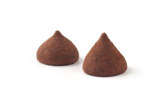 two truffle candies on a white background. High quality photo