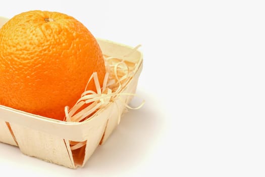 orange in a basket close-up on a white background. High quality photo