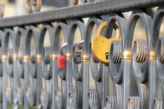 the castle in the form of heart on a metal fence. High quality photo