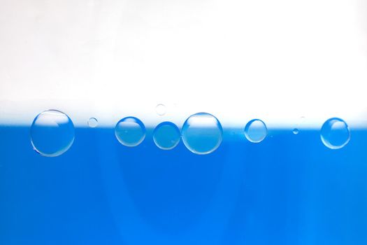 air bubbles in blue shampoos as background. High quality photo