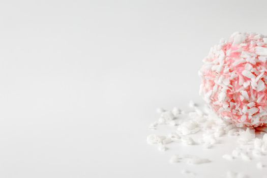 pink chocolate candy on a white background. candy ball macro. isolate. High quality photo