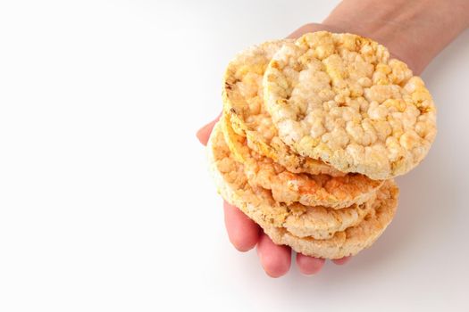 cornbread in hand on a white background. healthy food. macro. isolate. High quality photo
