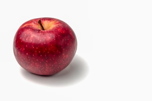 red Apple close-up on a white background. High quality photo