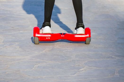 Teens riding gyrometer and skateboard closeup. High quality photo