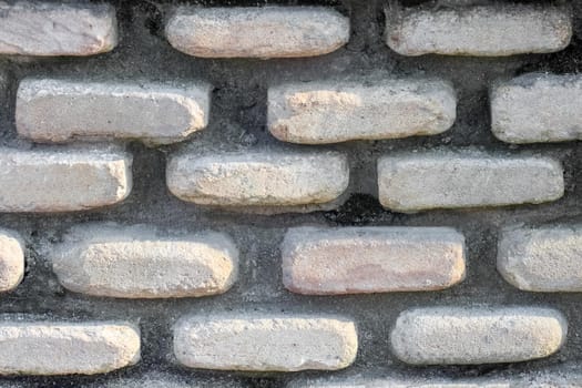 masonry wall paving stones as a background close up. High quality photo