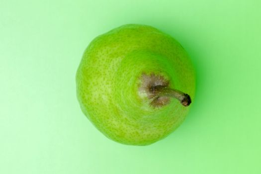 pear on a green background close-up. place for inscription. High quality photo