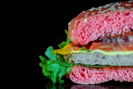 red hamburger on a black background macro. High quality photo