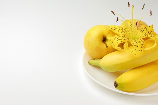 tiger Lily with banana and Apple on a white background close-up. isolate. High quality photo