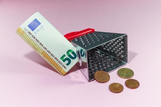 exchange euros for cents using a grater isolate. High quality photo