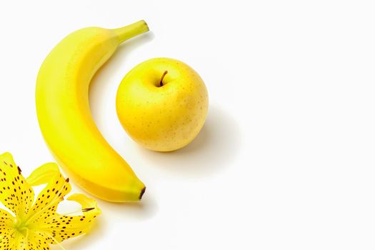 tiger Lily with banana and Apple on a white background close-up. isolate. High quality photo