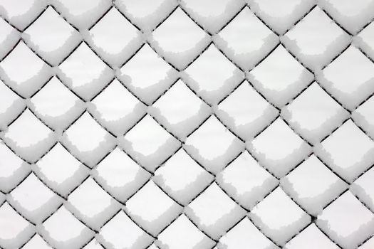 netting netting covered with snow as background. High quality photo